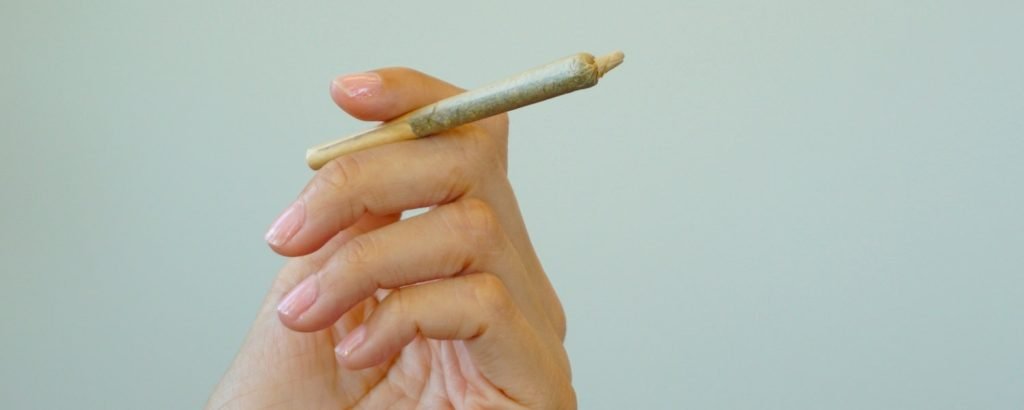holding a pre-roll
